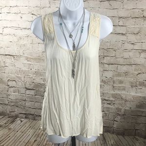 Active rayon tank with lace/crochet shoulder back.